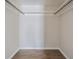 Walk-in closet featuring wood-look flooring, ample space and lighting at 4708 Michael Ct # 103, Tampa, FL 33614
