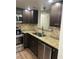 Well-equipped kitchen featuring granite counters, stainless appliances, and ample cabinetry at 4708 Michael Ct # 103, Tampa, FL 33614