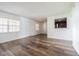 Inviting living room with hardwood floors, ample lighting, and an opening to the kitchen area at 4708 Michael Ct # 103, Tampa, FL 33614