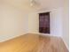 Bright bedroom features wood laminate flooring, neutral walls, and a window with privacy blind at 4708 Michael Ct # 104, Tampa, FL 33614