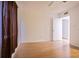 Bright bedroom features wood laminate flooring, neutral walls, and window with privacy blind at 4708 Michael Ct # 104, Tampa, FL 33614