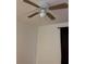 Bedroom ceiling fan with wooden blades at 4708 Michael Ct # 104, Tampa, FL 33614
