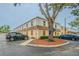 The building boasts tan stucco walls, light-colored siding, and assigned parking spaces for residents and guests at 4708 Michael Ct # 104, Tampa, FL 33614