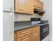 Kitchen features countertop space, wooden cabinets, and black range at 4708 Michael Ct # 104, Tampa, FL 33614