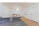 Bright living room has wood flooring, a dining table, and a door to the outside at 4708 Michael Ct # 104, Tampa, FL 33614