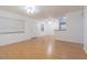 Spacious living room features wood flooring, bright windows and a door to the outside at 4708 Michael Ct # 104, Tampa, FL 33614