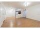 Open-concept living room features wood flooring and an open flow to the kitchen at 4708 Michael Ct # 104, Tampa, FL 33614