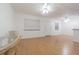 Open living room features a dining table with wood flooring and light walls at 4708 Michael Ct # 104, Tampa, FL 33614