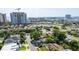Real estate aerial view showcasing a property near the water with city views in the background at 4735 W Leila Ave, Tampa, FL 33616
