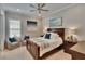 Relaxing bedroom with natural light, a comfortable bed, and stylish decor at 4795 Freccia Loop, Wesley Chapel, FL 33543