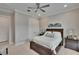 Inviting bedroom with a cozy bed, soft carpet, and a view of the closet at 4795 Freccia Loop, Wesley Chapel, FL 33543