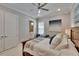 Cozy bedroom featuring a comfortable bed, soft pillows, and a closet at 4795 Freccia Loop, Wesley Chapel, FL 33543