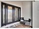 Inviting front entrance with decorative glass doors and comfortable seating at 4795 Freccia Loop, Wesley Chapel, FL 33543