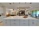 Open kitchen with an island, seamlessly flowing into the living and dining areas; great for Gathering and entertaining at 4795 Freccia Loop, Wesley Chapel, FL 33543