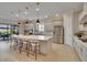 Spacious kitchen with an island and stainless steel appliances; perfect for cooking and entertaining at 4795 Freccia Loop, Wesley Chapel, FL 33543