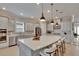 Bright kitchen features a large center island with white countertops and stainless steel appliances at 4795 Freccia Loop, Wesley Chapel, FL 33543