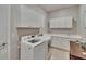 Efficient laundry room with modern washer, dryer, cabinets, and countertop for folding at 4795 Freccia Loop, Wesley Chapel, FL 33543