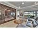 Sophisticated living room with a fireplace and entertainment center, perfect for relaxing and entertaining guests at 4795 Freccia Loop, Wesley Chapel, FL 33543