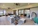 Spacious outdoor patio with comfortable furniture and ceiling fans, perfect for entertaining guests at 4795 Freccia Loop, Wesley Chapel, FL 33543