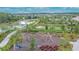 Aerial view of playground near walking path and neighborhood lake at 4795 Freccia Loop, Wesley Chapel, FL 33543