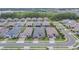 A peaceful street view shows multiple single-Gathering homes in a well-kept residential area at 4795 Freccia Loop, Wesley Chapel, FL 33543