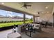 Relaxing sun room with comfortable seating and views of the garden at 4795 Freccia Loop, Wesley Chapel, FL 33543
