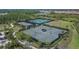 Aerial shot highlighting the community's well-maintained tennis and pickleball courts at 4795 Freccia Loop, Wesley Chapel, FL 33543