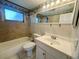 Bathroom featuring a shower-tub combo, vanity, and modern finishes at 4836 Daphne St, New Port Richey, FL 34652