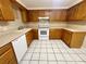 Bright kitchen featuring wooden cabinets, modern appliances, and tile flooring, perfect for cooking at 4836 Daphne St, New Port Richey, FL 34652