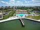 Beautiful aerial view of community pool, clubhouse, and private dock on the water at 4900 Brittany S Dr # 613, St Petersburg, FL 33715