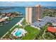 Aerial shot of the condo building, pool, waterfront and surrounding community at 4900 Brittany S Dr # 613, St Petersburg, FL 33715