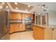 Bright kitchen featuring stainless steel appliances, granite countertops, and tile flooring at 4900 Brittany S Dr # 613, St Petersburg, FL 33715