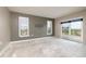 Living room with windows and sliding glass doors offers scenic city views from the balcony at 4900 Brittany S Dr # 613, St Petersburg, FL 33715
