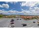 A view of the community parking lot with a clear blue sky and the city visible in the distance at 4900 Brittany S Dr # 613, St Petersburg, FL 33715