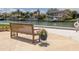 Enjoy water views from a bench with lovely flower planter and nearby dock at 4900 Brittany S Dr # 613, St Petersburg, FL 33715