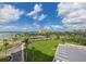 Scenic view of the waterfront with palm trees, lush green lawns and benches for seating at 4900 Brittany S Dr # 613, St Petersburg, FL 33715