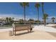 Enjoy water views from a shaded bench with lovely flower planter and dock nearby at 4900 Brittany S Dr # 613, St Petersburg, FL 33715