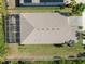 An aerial view of a beautiful home featuring a screened in lanai and mature landscaping at 5102 Coastal Scene Dr, Apollo Beach, FL 33572