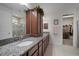Bright primary bathroom features granite counters, dual sinks, and an enclosed shower at 5102 Coastal Scene Dr, Apollo Beach, FL 33572