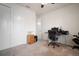 Functional bedroom showcasing carpeted floors, ample closet space, ceiling fan, and versatile layout for work and relaxation at 5102 Coastal Scene Dr, Apollo Beach, FL 33572