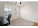 Neutral bedroom showcasing shuttered windows, carpeted floors, a ceiling fan, and offering a bright and airy ambiance at 5102 Coastal Scene Dr, Apollo Beach, FL 33572