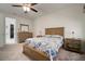 Neutral bedroom featuring a ceiling fan, window, nightstands and a dresser at 5102 Coastal Scene Dr, Apollo Beach, FL 33572