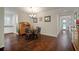 Inviting dining room with hardwood floors, chandelier lighting and classic dining furniture at 5102 Coastal Scene Dr, Apollo Beach, FL 33572