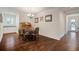 Inviting dining room with hardwood floors, chandelier lighting and classic dining furniture at 5102 Coastal Scene Dr, Apollo Beach, FL 33572