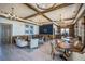 Beautiful lounge area with elegant seating, coffered ceilings, and a stylish bar area with natural light at 5102 Coastal Scene Dr, Apollo Beach, FL 33572