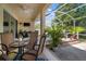 Inviting screened patio with dining set and outdoor cooking area for entertaining in a comfortable environment at 5102 Coastal Scene Dr, Apollo Beach, FL 33572