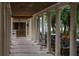 Covered outdoor walkway with classical columns, offering scenic views and seating areas at 5102 Coastal Scene Dr, Apollo Beach, FL 33572