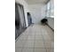 Enclosed balcony with tiled floor, ample light and a door to the outside at 5155 9Th N Ave # 206 B, St Petersburg, FL 33710