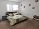 Comfortable bedroom featuring a cozy bed with decorative accents and a window for natural light at 5155 9Th N Ave # 206 B, St Petersburg, FL 33710