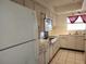 Kitchen boasts white cabinets, tile flooring, and plenty of counter space at 5155 9Th N Ave # 206 B, St Petersburg, FL 33710